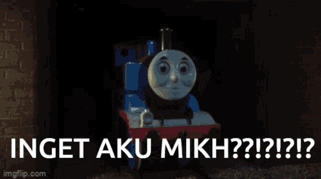 a picture of a thomas the tank engine with the words inget aku mikh written below it