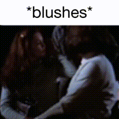 a blurry picture of a person with the words * blushes * on the bottom