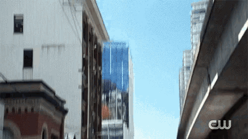 a cityscape with a cw logo on the bottom right