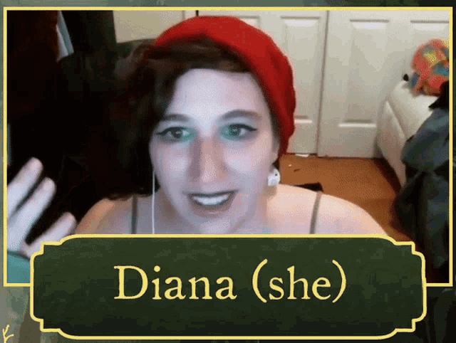 a woman wearing a red hat and ear buds says diana ( she )