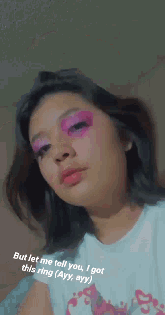 a girl with pink makeup on her face has a caption that says but let me tell you i got this ring ( ayy ayy )