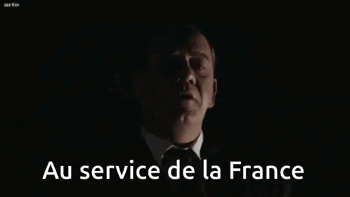 a man in a suit and tie with the words au service de la france