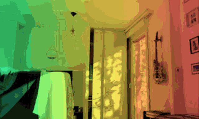 a room with a guitar hanging on the wall
