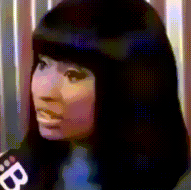 a close up of a woman 's face with a microphone and the letter b on it