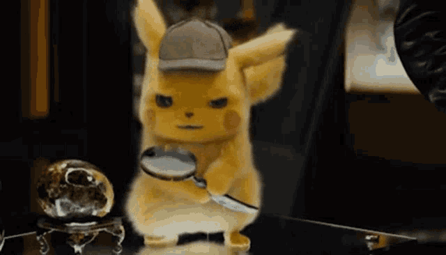 a stuffed animal with a hat is holding a magnifying glass and looking at something .