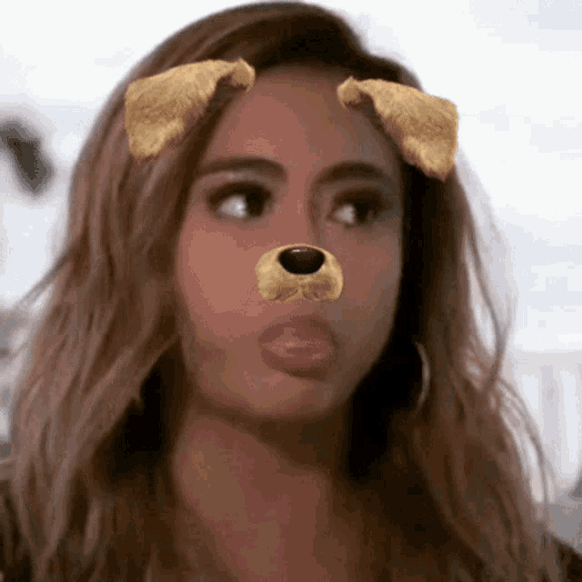 a woman is wearing a snapchat filter that looks like a dog