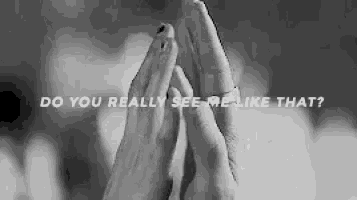 a black and white photo of a woman 's hands with the words `` do you really see me like that '' written above them .