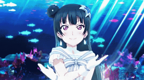 a girl in a white dress is standing in front of a coral reef .