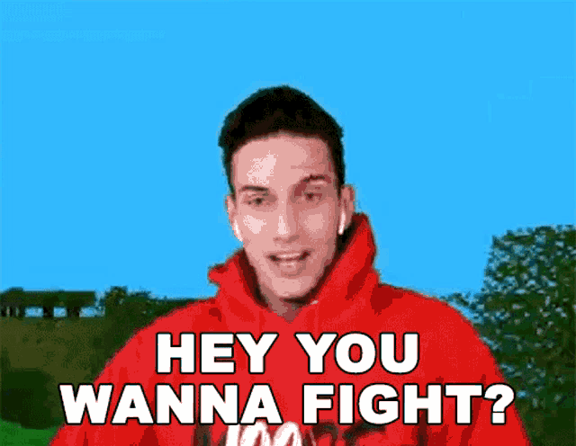 a man in a red hoodie says " hey you wanna fight ? "