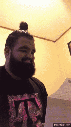 a man with a beard wearing a shirt that says tn on it
