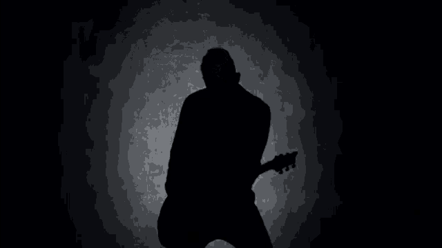 a person 's butt is visible in the dark in a blurry photo .
