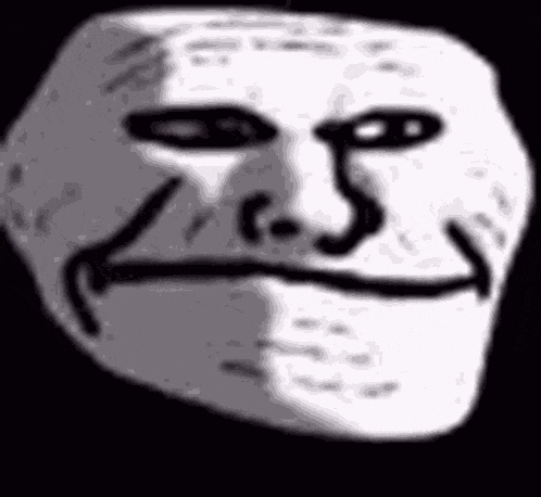a close up of a troll face on a black background with a smile on it .