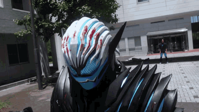 a person wearing a helmet that has blood on it