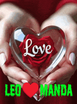 a woman is holding a glass heart with a red rose in it and the word love on it