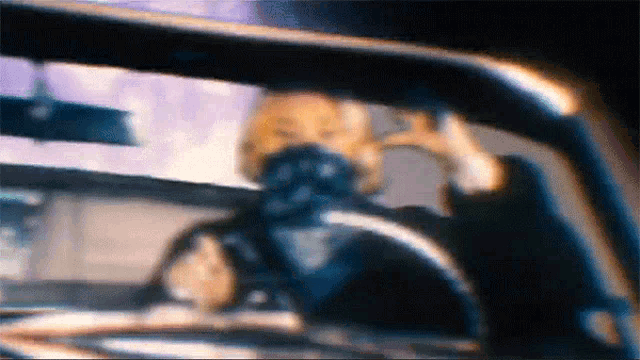 a blurry picture of a person in a car