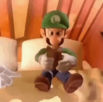 a close up of a cartoon character sitting on a bed holding a stick .