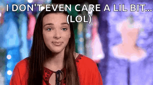 a girl in a red shirt is saying i don 't even care a lil bit lol