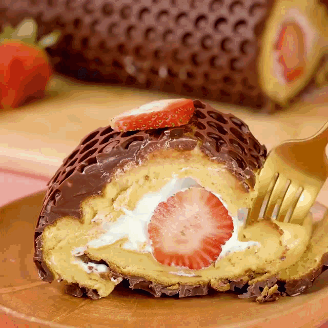 a piece of cake with a strawberry on top of it