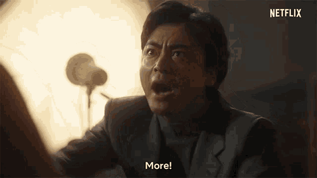 a man in a suit is saying more in a netflix ad