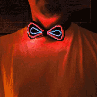 a person wearing a neon bow tie that is glowing in the dark