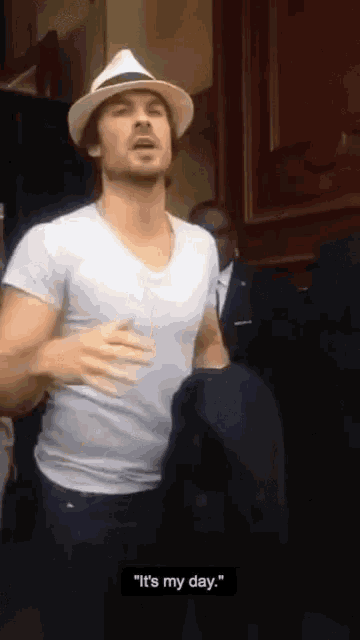 a man wearing a hat and a white shirt says it 's my day