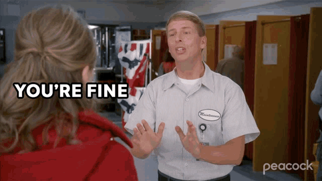 a man talking to a woman with the words " you 're fine " on the screen