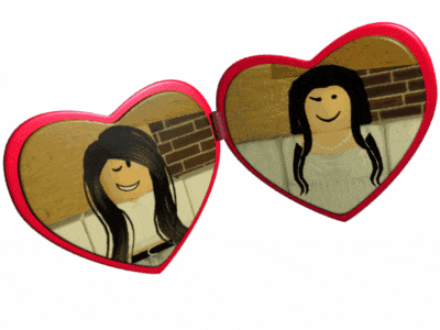 two heart shaped mirrors with a woman 's reflection on them