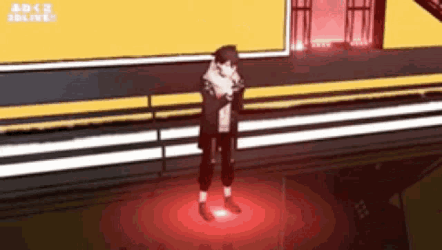 a person is standing in a dark room with a red light shining on them