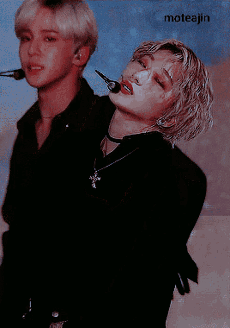 a man with a microphone in his mouth is standing next to another man with a microphone in his mouth
