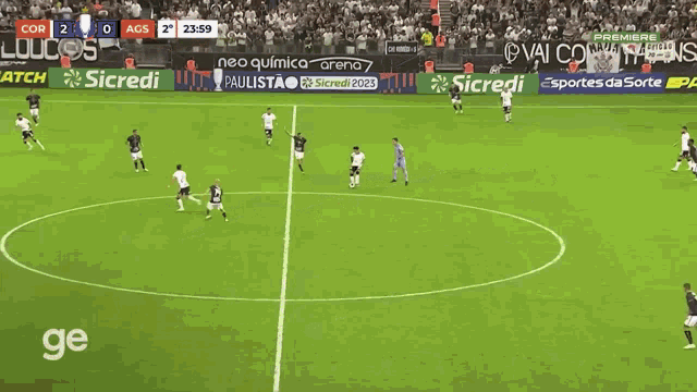 a soccer game is being played in a stadium with advertisements for assai