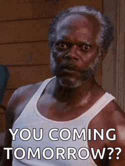a man with a beard is wearing a white tank top and says `` you coming tomorrow '' .