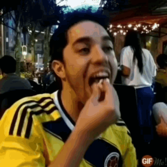 a man wearing a yellow and black jersey with the word gif on it
