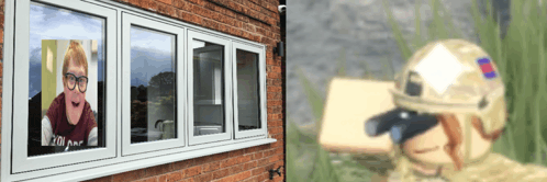 a soldier is looking out a window with a picture of a woman behind it
