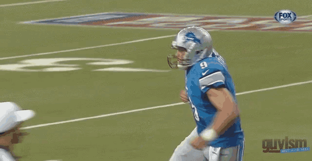 a football player wearing a helmet with the number 10 on it