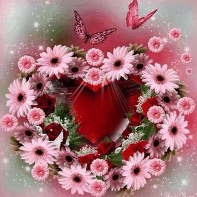 a heart shaped wreath of pink flowers with a butterfly flying around .
