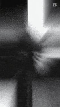 a black and white photo of a cross with the letter m on the bottom