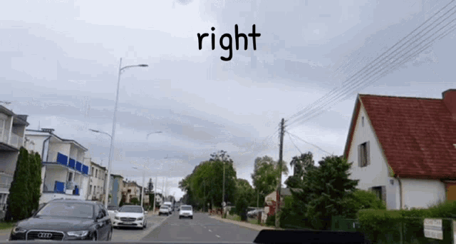 a car is driving down a street and the word right is above it