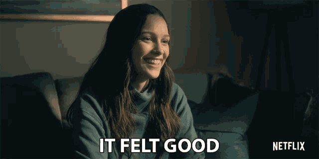 a woman sitting on a couch with the words " it felt good " written below her