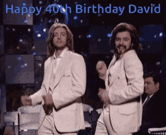 two men in white suits are dancing in front of a sign that says " happy 40th birthday david "
