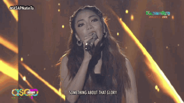 a woman singing into a microphone with the words just always seemed to bore me on the screen