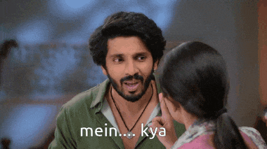 a man with a beard is talking to a woman with the words mein kya written on the bottom