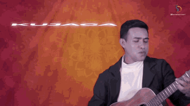 a man playing a guitar in front of a red background with the word kujaga on it