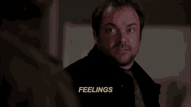 a man 's face is shown with the words feelings written above him