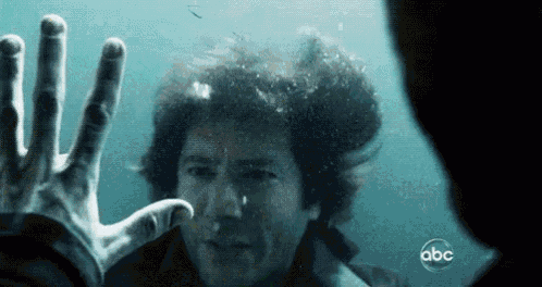 a man is swimming in the water with abc written on the bottom of the screen