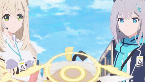 two anime girls are standing next to each other in front of a large circle .