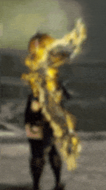 a blurred image of a person holding a large object