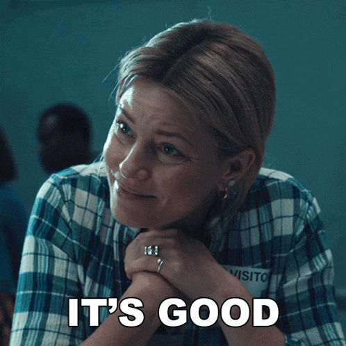 a woman in a plaid shirt with the words it 's good on her face