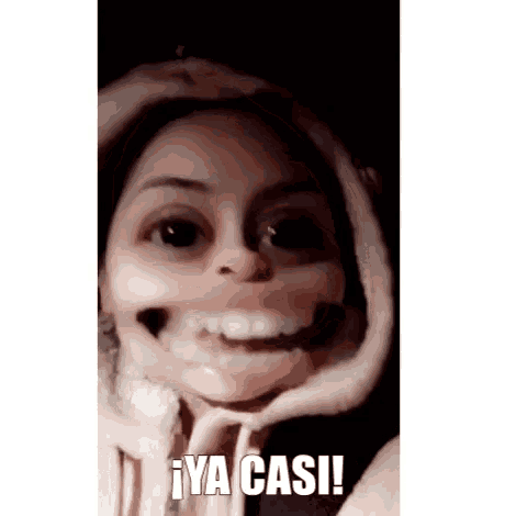 a close up of a woman 's face with the words ya casi on the bottom