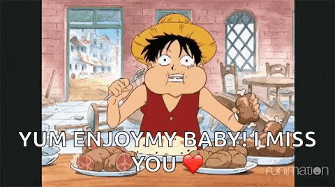 a cartoon of monkey d luffy sitting at a table eating a chicken leg .