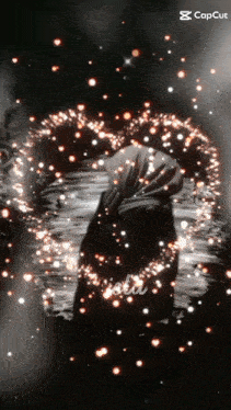 a black and white photo of a person surrounded by sparks with the caption capcut